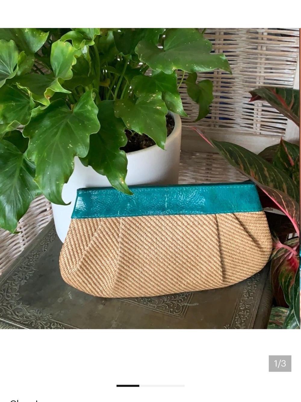 Woven teal clutch bag